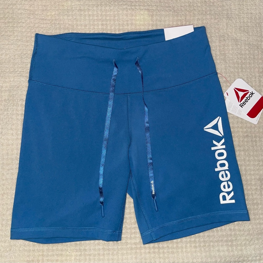 Reebok womans bike shorts. 7” inseam. Back pocket. New with Tags